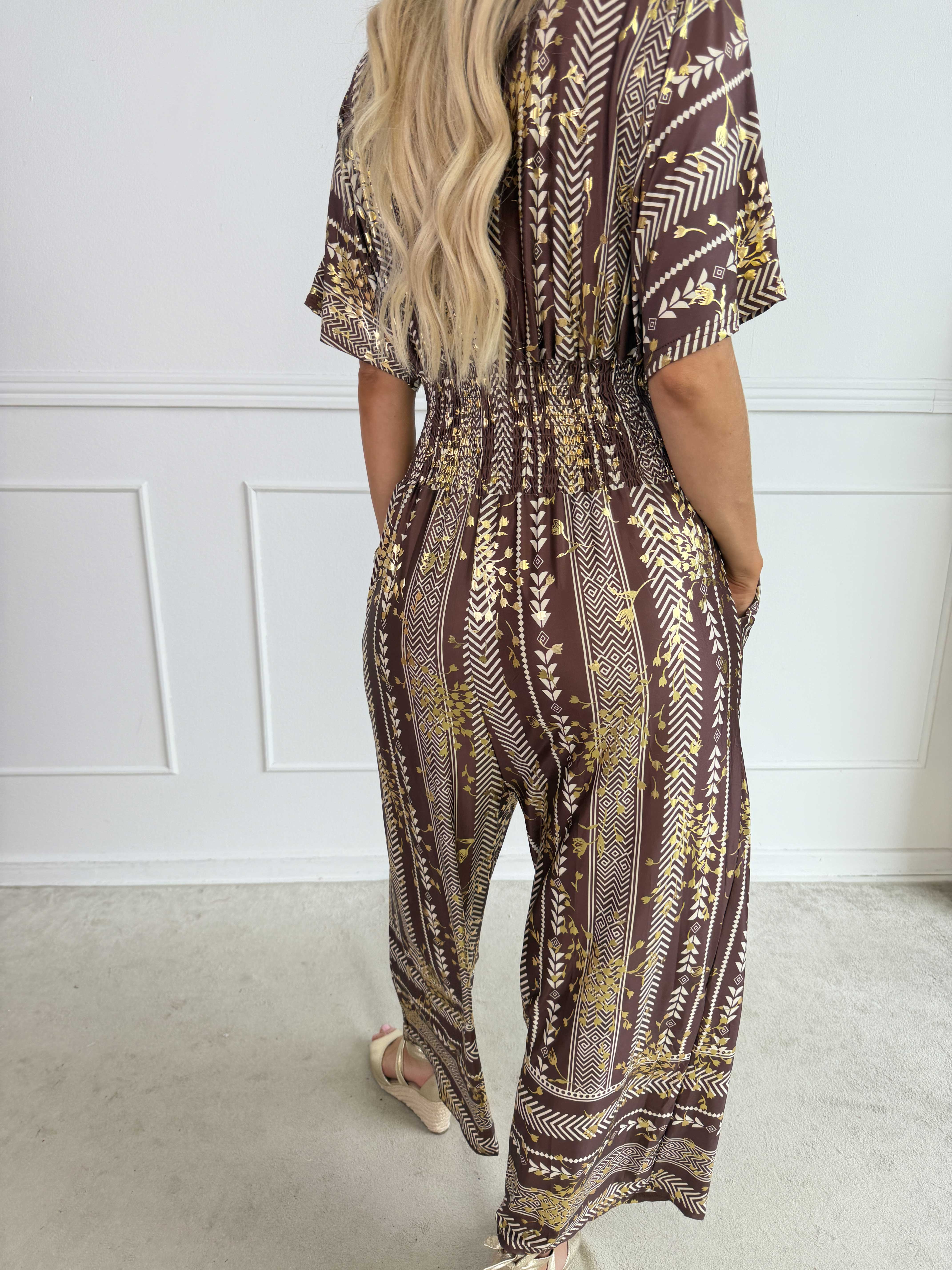 Pams Tribal Jumpsuit - Elastisk mønstret buksedragt med små guld blomster